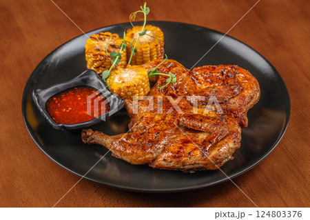 Fried chicken tobacco on a dark background. top view. copy space for text 124803376