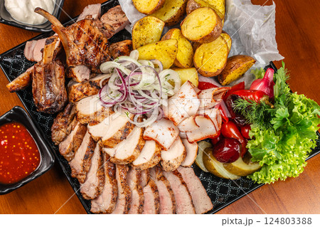 Grilled meat chop sliced with herbs and spices. top view. copy space Grilled meat chop sliced with herbs and spices. top view. copy space 124803388