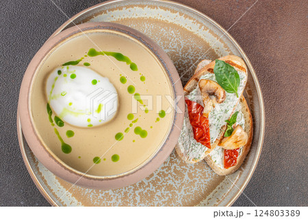 Delicious soup puree with wild mushrooms. champignon soup with bread. top view. copy space for text 124803389