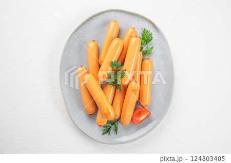 Boiled sausages. Chicken sausage on plate. Ingredients for hot dogs. top view, copy space 124803405