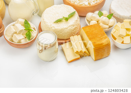 Assorted dairy product milk, cream, yogurt, butter, cheese, cottage cheese on a light background, top view. copy space Assorted dairy product milk, cream, yogurt, butter, cheese, cottage cheese on a light background, top view. copy space 124803428