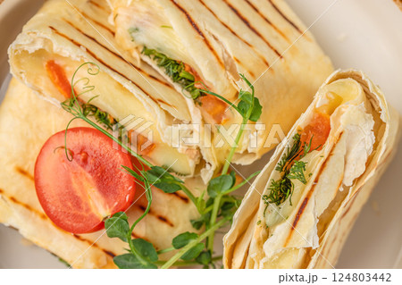 Wrap sandwich grilled with feta cheese. Top view 124803442