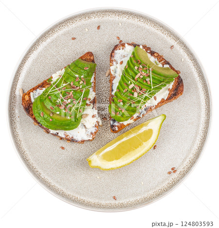 Healthy avocado toasts with rye bread, sliced avocado, cheese. isolated on white background. top view Healthy avocado toasts with rye bread, sliced avocado, cheese. isolated on white background. top view 124803593