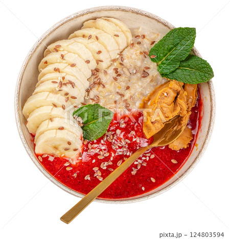 oatmeal with berries, banana, peanut butter in bowl isolated on white background. top view. Healthy vegan breakfast concept 124803594