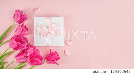 Pink celebration background, flowers, hearts and gift. Long banner format. top view. copy space Pink celebration background, flowers, hearts and gift. Long banner format. top view. copy space 124803642