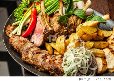 platter of different kebabs from chicken fillet, pork kebab of veal. Top view platter of different kebabs from chicken fillet, pork kebab of veal. Top view 124803686