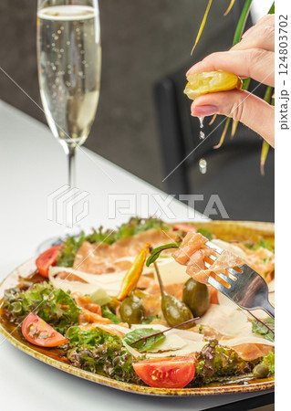 Salmon carpaccio with champagne, salad salmon appetizer served on a plate, copy space Salmon carpaccio with champagne, salad salmon appetizer served on a plate, copy space 124803702