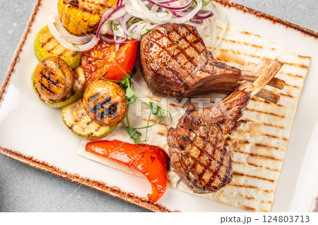Grilled lamb chop steak with vegetable. Delicious juicy meat on the bone or rack. copy space 124803713