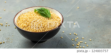 pasta ptitim decorated basil leaves, Long banner format. top view. copy space for text pasta ptitim decorated basil leaves, Long banner format. top view. copy space for text 124803757