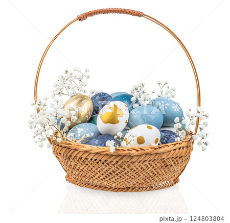 Easter colored eggs with flowers in a basket isolated on white background 124803804