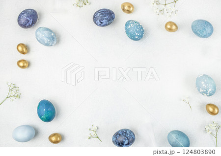 Happy Easter. Congratulatory easter background. Easter eggs and flowers on white background. top view. copy space Happy Easter. Congratulatory easter background. Easter eggs and flowers on white background. top view. copy space 124803890