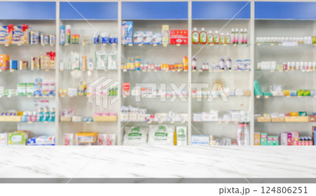 Empty white marble counter top with blur pharmacy drugstore shelves background 124806251