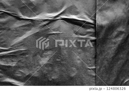 Black crumpled and creased paper poster grunge texture background Black crumpled and creased paper poster grunge texture background 124806326
