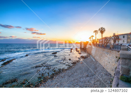 Amazing evening cityscape of historical part of Alghero town. Amazing evening cityscape of historical part of Alghero town. 124807102