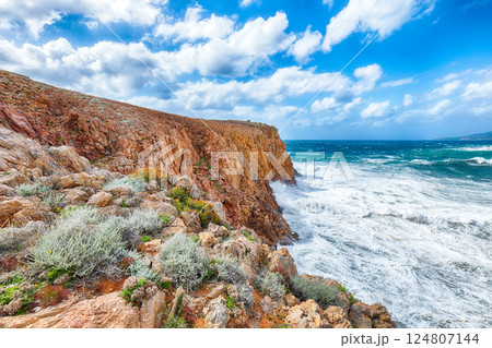 Attractive view of cliffs in valley Cala Domestica  and storm on the sea 124807144