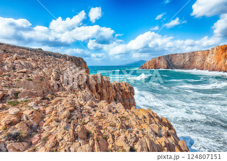 Attractive view of cliffs in valley Cala Domestica  and storm on the sea 124807151