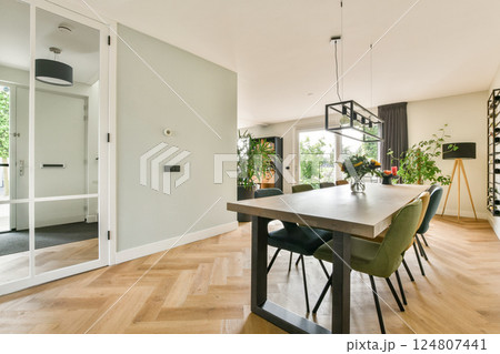 Stylish dining area featuring modern furniture, a well-lit atmosphere, and inviting decor that enhances the overall aesthetic of the space. Stylish dining area featuring modern furniture, a well-lit atmosphere, and inviting decor that enhances the overall aesthetic of the space. 124807441