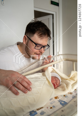 Father Adoring His Newborn Baby in Hospital Father Adoring His Newborn Baby in Hospital 124807728