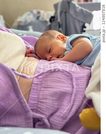 Newborn Baby Resting on mother tummy Newborn Baby Resting on mother tummy 124807816