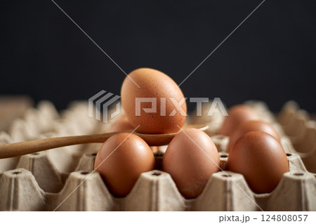 Close up brown eggs in egg box 124808057