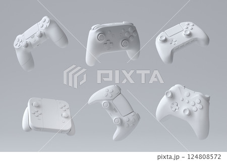 Set of flying gamer joysticks or gamepads on monochrome background 124808572