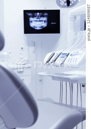 Modern dental clinic interior with x-ray display - advanced care equipment and technology 124809087