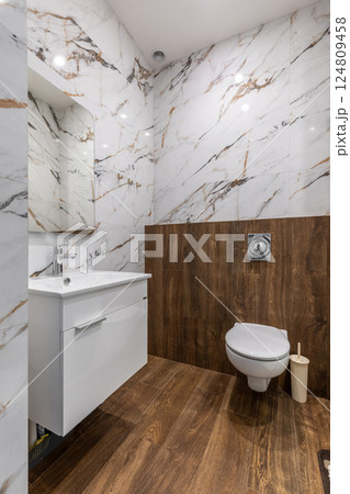 Luxury Bathroom with Marble and Wooden Accents Luxury Bathroom with Marble and Wooden Accents 124809458