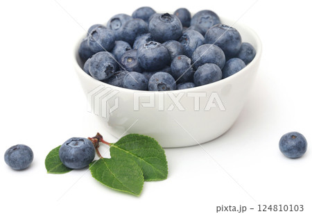 Fresh blueberries over white background 124810103