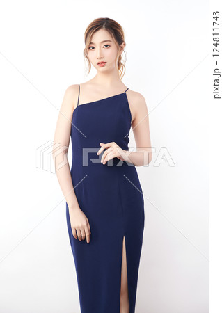 Beautiful face of young Asian woman in sexy dress Blue Perfect slim body on white background, plastic surgery and aesthetic cosmetology, Facial and skin care concept 124811743
