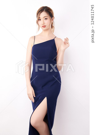 Beautiful face of young Asian woman in sexy dress Blue Perfect slim body on white background, plastic surgery and aesthetic cosmetology, Facial and skin care concept 124811745