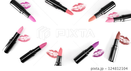 Flat lay lipsticks with lips imprints. Flat lay lipsticks with lips imprints. 124812104