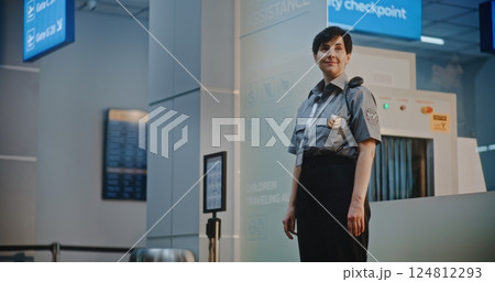 Airport Terminal: Airline Pilot and Two Flight Attendants Walking After Commercial Flight Airport Terminal: Airline Pilot and Two Flight Attendants Walking After Commercial Flight 124812293