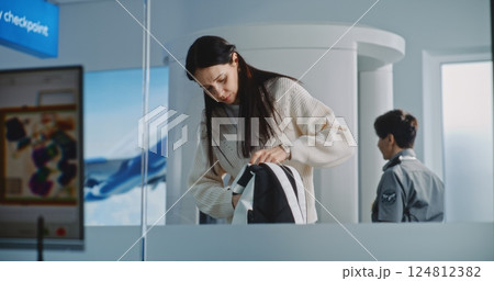 Woman with Carry-On Baggage During Screening. Computer Screen with X-ray Images of Luggage Woman with Carry-On Baggage During Screening. Computer Screen with X-ray Images of Luggage 124812382