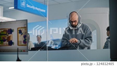 Diverse People with Suitcases During Screening. Screen with X-ray Images of Luggage Scanning Diverse People with Suitcases During Screening. Screen with X-ray Images of Luggage Scanning 124812405