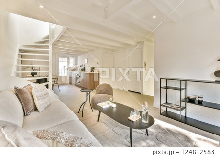 Stylish and serene living room featuring a neutral color palette, contemporary furniture, and a blend of textures. Ideal for inspiring modern home decor. 124812583