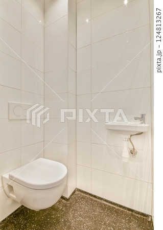 A sleek and modern bathroom showcasing minimalist design with clean lines, white tiles, and subtle lighting, ideal for contemporary homes. A sleek and modern bathroom showcasing minimalist design with clean lines, white tiles, and subtle lighting, ideal for contemporary homes. 124813267