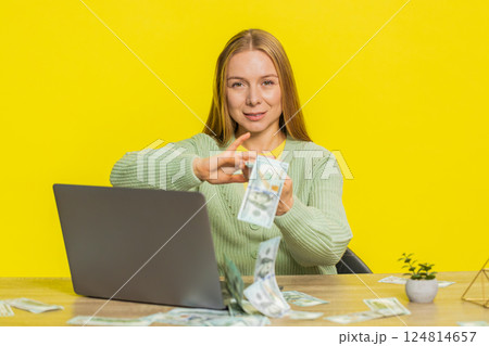 Woman wasting throwing sharing money dollar cash around, big profit, winning lottery casino jackpot 124814657