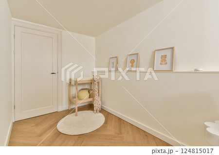 A serene and welcoming hallway featuring soft wood flooring, simple decor, and charming framed artworks that evoke a warm, minimalist aesthetic. A serene and welcoming hallway featuring soft wood flooring, simple decor, and charming framed artworks that evoke a warm, minimalist aesthetic. 124815017