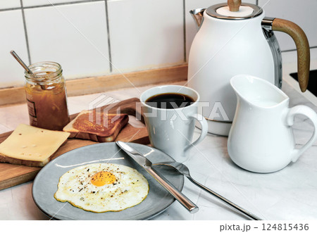 Breakfast with fried egg, toast and coffee Breakfast with fried egg, toast and coffee 124815436