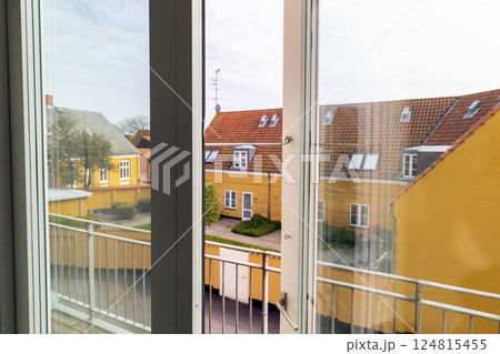 Open window overlooking the street on a summer day 124815455