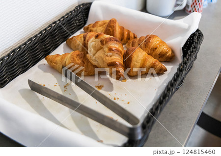 Fresh croissants in a bastet in a hotel kitchen. 124815460