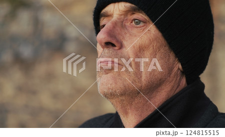Elderly Man With Woolen Hat Looks At The Panoramic View Elderly Man With Woolen Hat Looks At The Panoramic View 124815515