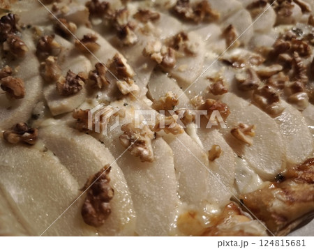Rustic pear and walnut tart featuring golden brown pastry, melted cheese, dripping with warmth and bakery fresh allure easy dinner for Valentines day 124815681