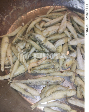 Close up of freshly prepared fried fish, showcasing their crispy texture and golden color, captured in bibione, italy during july 124816153