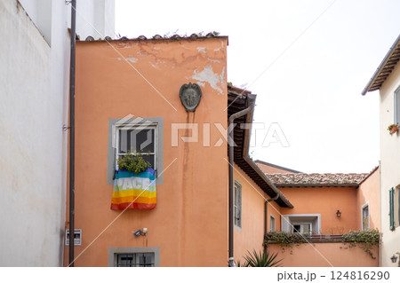Rainbow flag hanging out of a window during the Pride festival 124816290