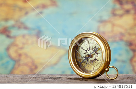Old compass and map 124817511