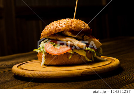 Bacon burger with beef patty on wooden table 124821257