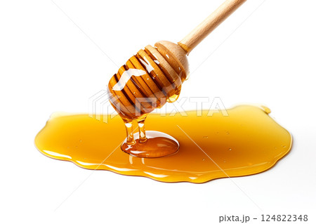 Honey dripping from dipper isolated on white background 124822348