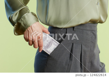Pocketing a hundred dollar bill Pocketing a hundred dollar bill 124822614