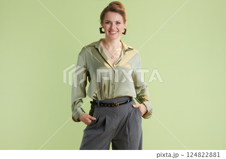 Confident woman in green blouse Confident woman in green blouse 124822881